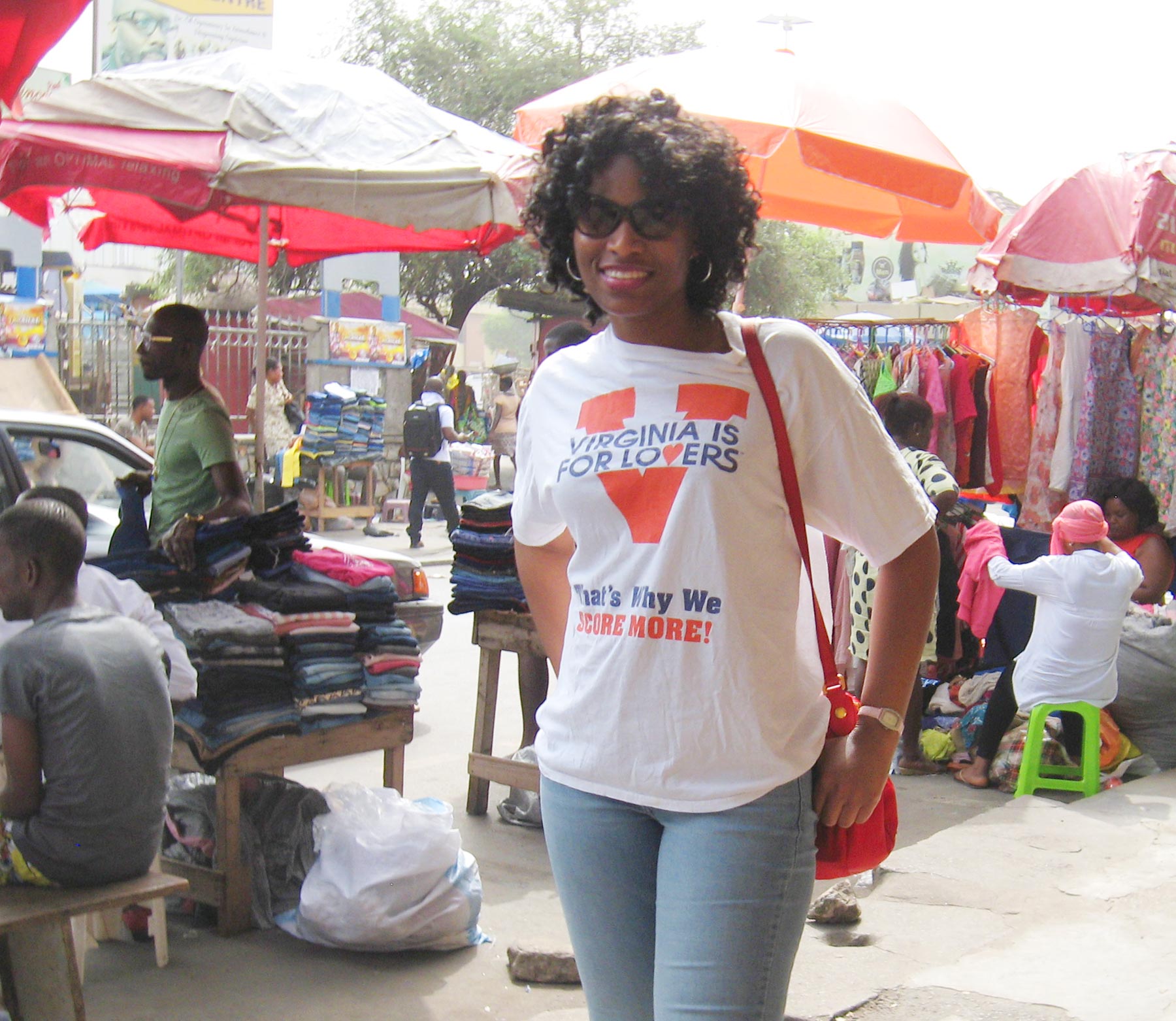 Genevieve poses in front of market in Ghana